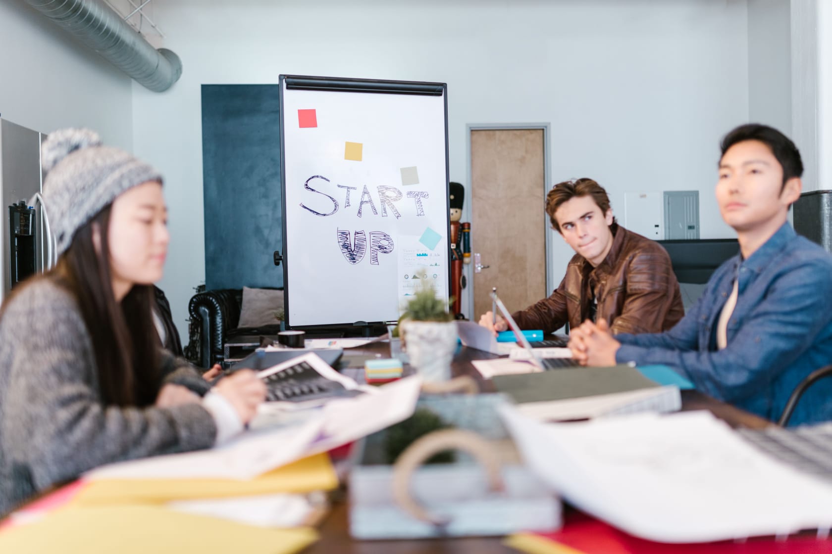 Founders working through ideas in an early-stage startup room