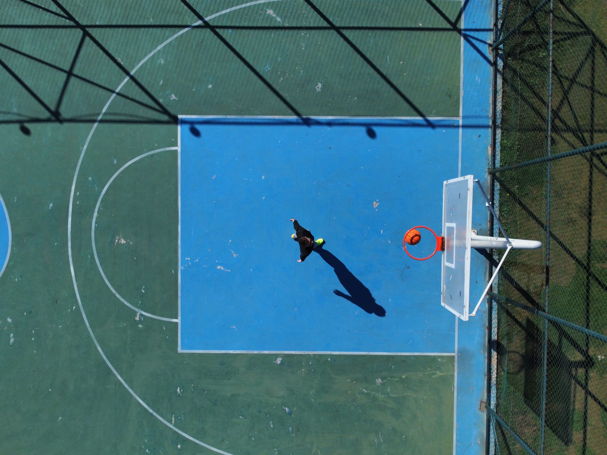 Aerial view of an athlete on a basketball court